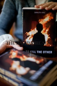 hm Ellicott City, MD Photo date: 06-06-2011 Photo by: Nate Pesce Pictured is a shot of author Danuta Hinc holding some copies of her new book "To Kill The Other." Photos taken in her home for a feature on Hinc and the new book.